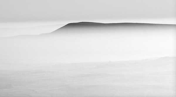 Ingleborough summit looking to Pendle Hill